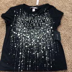 Black With Gold Sparkles Victoria Secret Fashion Show Tshirt Cotton Graphic Tee For Night Out, Victoria's Secret Tops For Night Out In Spring, Graphic Tee With Letter Print For Night Out, Black Graphic Tee For Night Out, Victoria's Secret Black Top For Night Out, Victoria's Secret Black Tops For Spring, Victoria's Secret Casual Tops With Graphic Print, Casual Victoria's Secret Tops With Graphic Print, Victoria's Secret Summer Tops With Letter Print