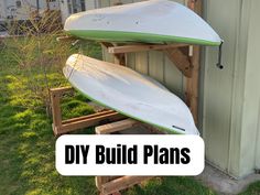 two surfboards are stacked on top of each other in front of a building with the words diy build plans