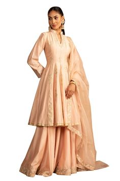 Peach peplum kurta with gota work embroidery. Paired with coordinating lehenga and dupatta. - Aza Fashions Semi-stitched Cotton Silk Sharara For Wedding, Semi-stitched Cotton Silk Sharara For Reception, Cotton Silk Semi-stitched Sharara For Reception, Reception Cotton Silk Semi-stitched Sharara, Fitted Cotton Silk Anarkali Set For Wedding, Fitted Cotton Silk Sharara For Weddings, Luxury Gota Work Peplum Dress, Fitted Cotton Silk Sets For Wedding, Tissue Silk Anarkali Set With Traditional Drape