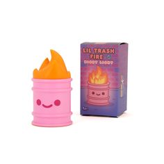 a pink toy with an orange flame in it's mouth next to a box