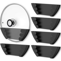 five black and white wall mounted shelves next to each other with holes in the middle