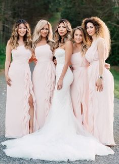 the bridesmaids are posing for a photo together in their pink gowns and dresses