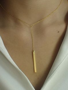 Dainty Bar Necklace / Skinny Vertical Bar / Silver Gold plated Necklace / Simple Everyday Necklace / Bridesmaids Gift About Features- * Made to order * Materials: 925 Sterling Silver * Gold color: Yellow Gold Plating, White Gold Plating, and Rose Gold Plating * Bar dimensions: 36mm long x 3mm wide * Layaway Plan Available * SKU: N173 For Ready-to-ship items search here, https://etsy.me/39BDvMS As a reference, I've included the widths of coins for your visual reference: Dime = 1.25mm Penny = 1.4m Minimalist Yellow Gold Necklace For Party, Elegant Pendant Necklace With Adjustable Length, Minimalist Party Necklace With Adjustable Length, Formal Jewelry With Clavicle Chain And Rectangular Pendant, Gold Rectangular Pendant Jewelry For Wedding, Gold Necklace For Wedding, 16 Inch Length, Elegant Wedding Necklace With Adjustable Length, Minimalist Gold Plated Adjustable Jewelry, Minimalist Gold-plated Jewelry With Adjustable Length