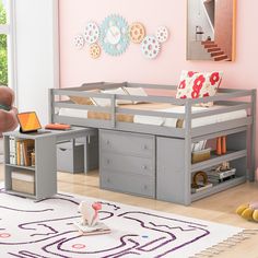 a child's bedroom with pink walls and furniture