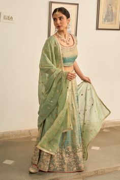 Turquoise lehenga with zardozi embroidered floral motifs. Comes with matching blouse and gota lace embellished dupatta. - Aza Fashions Unstitched Raw Silk Lehenga With Gota Work, Bollywood Style Tissue Silk Palazzo Set For Reception, Pista Green Lehenga With Resham Embroidery In Organza, Pista Green Organza Lehenga With Resham Embroidery, Pista Green Organza Choli With Cutdana, Designer Wear Pista Green Organza Choli, Reception Palazzo Set With Sheer Dupatta In Dola Silk, Tissue Silk Palazzo Set For Reception, Sheer Dupatta Palazzo Set For Reception