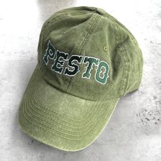 Store bought or homemade pesto? One size fits most dad hat. Embroidered in the USA. Hat made in Bangladesh. 100% cotton. Unisex. Cheap Dad Hat For Spring Streetwear, Cheap Embroidered Dad Hat For Streetwear, Cheap Trendy Dad Hat For Streetwear, Cheap Fun Dad Hat Baseball Cap, Cheap Funny Cap Style Hat, Cheap Vintage Dad Hat For Spring, Cheap Retro Dad Hat Baseball Cap, Cheap Casual Dad Hat For Everyday Use, Affordable Vintage Dad Hat For Outdoor