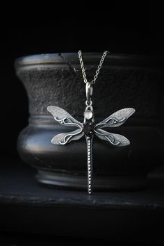 ITEM DESCRIPTION: The size of the pendant - H5 х W5 cm (2 x 2 inches), weight 4 g. I made this elegant dragonfly pendant of sterling silver, smoky quartz, and rose quartz. There are a beautiful natural texture and wire weave on the wings. And this is especially attractive. The pendant is made of high quality and skillful. Silver dragonfly will be a great complement to your jewelry collection or a gift to someone you love. Ooak jewelry made by eco-friendly materials. This handmade necklace will c Elegant Silver Dragonfly Jewelry, Elegant Sterling Silver Dragonfly Jewelry, Elegant Sterling Silver Dragonfly Necklace, Hammerhead Shark Necklace, Shark Necklace, Animal Pendant, Dragonfly Earrings, Dragonfly Pendant, Garnet Jewelry