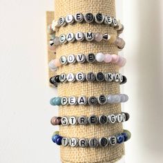 Here you see an exquisitely curated set of delightful, powerful, quality bracelets to fit almost every need you could possibly have.  All of the bracelets are made with 6mm natural stone beads, and the letters are painted acrylic so don't come at me when you find out they aren't real metal. Read on to discover some fascinating and some boring facts about the stones used in these bracelets. They are in alphabetical order because I don't play favorites. (I mean, I do have a favorite but I'm not telling you which one it is) BLESSED:  Sea Sediment Jasper - Also known as Shoushan Jasper, this is absolutely one of my favorite types of Jasper to work with because of its beautiful swirling colors. Jaspers are known for providing healing and stability, as well as protection against evils around you Inspirational Adjustable Hypoallergenic Beaded Bracelets, Inspirational Beaded Bracelets For Everyday, Inspirational Adjustable Beaded Bracelets With Round Beads, Inspirational Adjustable Hypoallergenic Bracelet, Inspirational Hypoallergenic Adjustable Bracelet, Adjustable Healing Bracelets With Meaningful Style, Spiritual Stretch Bracelet With Natural Stones, Inspirational Adjustable Stretch Bracelet With Round Beads, Everyday Spiritual Stretch Bracelet With Natural Stones