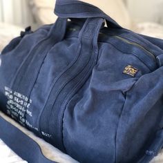 Polo By Ralph Lauren Mens Bag Navy Blue Duffle Bag Sports Travel * Two Top Handles, 7" Drop * Removable, Adjustable Shoulder Strap With A 21” Maximum Drop * Top Zip Closure * Large Pocket At The Interior * Unlined * Approx. 11” W X 21” L X 9” D * Never Used, New, Without Tag “What I Do Is About Living The Best Life You Can And Enjoying The Fullness Of The Life Around You- From What You Wear To The Way You Live To The Way You Love.” - Ralph Lauren- Blue Duffle Bag With Zipper Closure For On-the-go, Sporty Canvas Bag With Zipper Closure, Sporty Canvas Bag With Large Capacity, Large Capacity Sporty Canvas Bags, Sporty Canvas Bag With Zipper Pocket, Blue Duffle Bag With Zipper Closure, Blue Duffle Bag With Zipper Pocket For Daily Use, Blue Duffle Bag With Pockets For Everyday, Everyday Blue Duffle Bag With Zipper Closure