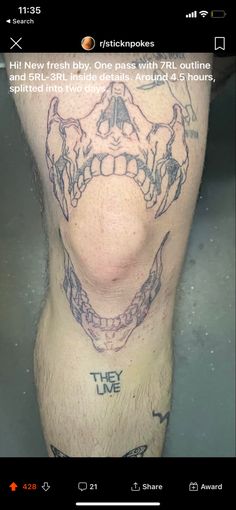 a man's leg with tattoos on it