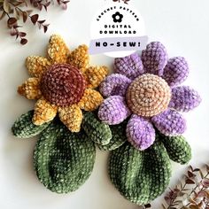 two crocheted flowers sitting on top of each other