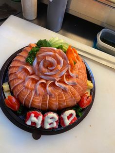 a plate that has some kind of food on it with the word happy spelled out