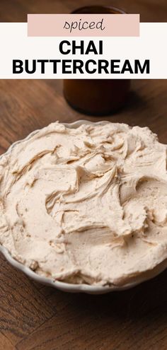 a bowl filled with whipped cream on top of a wooden table