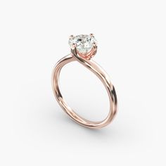 a rose gold engagement ring with an oval cut diamond in the center, on a white background