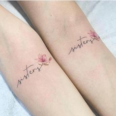 two matching tattoos with the words sisters and lotuses on their legs, both written in cursive handwriting