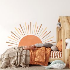 a child's bedroom with an orange sun wall decal on the wall and bed