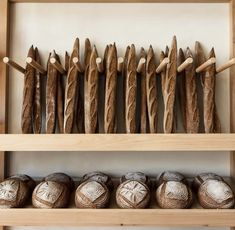 some bread sticks are lined up on a shelf