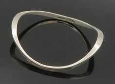 "MEXICO 925 Sterling Silver - Vintage Smooth Curved Bangle Bracelet - BT6235  MEXICO 925 Sterling Silver - Vintage Smooth Curved Bangle Bracelet - BT6235  Jewelry Type:         Bracelet   Metal Type:            925 Silver   Metal Size:             7.5\"  Stone Type:            N/A  Condition:              N/A  Jewelry Weight:     18.3 Grams  PLEASE NOTE: THIS ITEM IS PRE-OWNED. ALTHOUGH MOST ITEMS ARE IN VERY GOOD CONDITION, SOME MAY NEED CLEANING AND/OR MINOR REPAIRS. WE MAKE A VERY STRONG EFFORT TO UPLOAD CLEAR PICTURES. PLEASE INSPECT ALL PICTURES AND ASK ALL QUESTIONS YOU MAY HAVE PRIOR TO MAKING A PURCHASE. NOT ALL STONES ARE GENUINE, SOME ARE ENHANCED OR CREATED." Modern Bangle With Sterling Silver Clasp, Contemporary Sterling Silver Bracelet With Polished Finish, Contemporary Polished Sterling Silver Bracelet, Modernist Sterling Silver Bangle Bracelet Gift, Modernist Polished Sterling Silver Bangle, Sterling Silver Modernist Bangle, Modernist Sterling Silver Bracelet As Gift, Modern Sterling Silver Bangle With Silver Clasp, Modernist Polished Bangle Bracelets