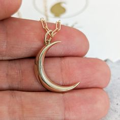 "Bold yet minimal this crescent pendant comes in waning moon phase although we can design it in any moon phase so don't hesitate to ask for quote.  The necklace can be bought as a standalone pendant or a full necklace with a high-quality Italian imported cable chain. Prefer a larger or thicker crescent or would you like to add another symbol or some text? We can make whatever you have in mind! Send us a message now for a no-obligation quote. :) DETAILS - Made in NYC, USA in our family studio. - 24mm long (without bail) and maximum thickness is 3.5mm. Contact us for larger dimension. - 3.4 grams in 14k. - High polish (if you want satin/brush finish leave a note about this in notes section at checkout) - Buy as standalone pendant or with chain as a necklace. - Optional chain is a Italian imp Elegant Crescent Moon Phase Jewelry, Minimalist Jewelry With Moon Charm, Minimalist Moon Phase Round Pendant Jewelry, Silver Half Moon 14k Gold Jewelry, Minimalist 14k Gold Moon Charm Jewelry, Minimalist 14k Gold Half Moon Necklace, 14k Gold Celestial Jewelry Featuring Moon Phases, Crescent-shaped 14k Rose Gold Jewelry, 14k Rose Gold Crescent Jewelry