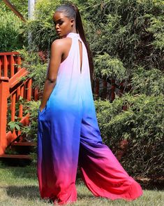 We are obsessed with the rays of colors in this jumpsuit. Providing a comfortable fit and flowy silhouette, this jumpsuit is ideal for any occasion. The high neck and button closure make it a unique but classic piece. A lined interior ensures it is comfortable to wear no matter the situation. Model Is Wearing A Small High Neck Jumpsuits And Rompers For Summer, Trendy Wide Leg Jumpsuits And Rompers For Vacation, Trendy Wide-leg Jumpsuits And Rompers For Vacation, Trendy Wide-leg Jumpsuits For Vacation, Multicolor Wide Leg Jumpsuits And Rompers For Beach, Flowy Sleeveless Jumpsuits And Rompers For Day Out, Multicolor Wide Leg Jumpsuits And Rompers For Summer, Blue Strapless Wide Leg Jumpsuit For Summer, Flowy Sleeveless Jumpsuit For Day Out