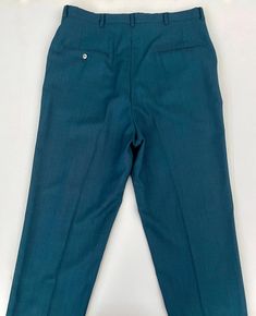 "Vintage Men's 70's Teal, Black, Wool Blend, Relaxed Fit, Cuffed Pants (W34) These 1970's Men's Pants come in a teal and black wool blend fabric with two front pockets, two back pockets and have a nylon zipper fly with a relaxed fit leg with a cuffed bottom hem. The pants are medium weight and have a slight stretch. Wool Blend No interior labels *These pants are in excellent condition. *If shipped within the US, they will ship Priority Mail for a quick delivery! Size: (34\" x 28 1/2\") Waist: 34 60’s Mod, Cuffed Pants, Shirt And Pants, Knit Shirt, Quick Delivery, Black Wool, Men's Pants, Medium Weight, Vintage 70s