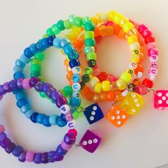 Cute kandi bracelets with dice charms Rave Style Jewelry With Letter Beads As Gift, Rave Style Jewelry With Letter Beads For Gift, Bracelets Kandi, Diy Kandi Bracelets, Diy Kandi, Rave Fits, Kandi Kid, Stretchy Beaded Bracelet, Pony Bead Patterns