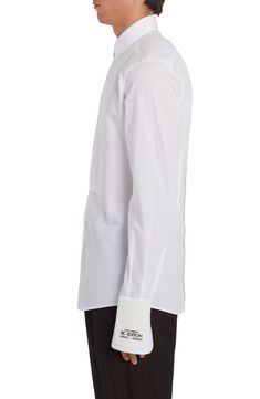 From the label's 'Re-Edition' collection comes this cotton-poplin shirt that features a partially hidden placket and a tuxedo-style bib. 31" length; 38" chest (size Medium) Front button closure Point collar Long sleeves with two-button cuffs 100% cotton Dry clean Made in Italy Men's Designer Clothing Designer Fitted White Dress Shirt, Designer Slim Fit Dress Shirt For Formal Occasions, Designer White Dress Shirt For Semi-formal Occasions, White Formal Shirt With Concealed Placket, Luxury Fitted Shirt For Daywear, Designer Fitted Shirt For Daywear, Fitted Poplin Shirt For Daywear, Luxury Fitted Daywear Shirt, Designer Fitted Shirt With Concealed Placket