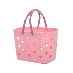 a pink shopping bag with hearts cut out on the side and handles, sitting against a white background