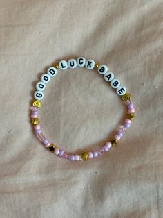 A hand-crafted glass bead friendship bracelet highlighting Chappell Roan's song "Good Luck Babe"! A simple and cute way to show off your favorite song or a great concert accessory!  This bracelet is made with Czech glass beads, plastic letter beads, plastic spacer beads, and is on an elastic thread measured at about 10 inches in length for a relaxed/loose fit. If you would like the bracelet you order to be smaller or larger, please leave the requested size in inches in the personalization box!  All bracelets are made to order and are typically shipped out within 1-3 business days unless otherwise stated. Adjustable Kpop Bracelets With Round Beads, Casual Beaded Jewelry For Best Friend Gift, Pink Beaded Jewelry For Best Friend Gift, Adjustable Kpop Bracelets With Letter Beads, Adjustable Beaded Kpop Bracelets, Adjustable Kpop Letter Beads Bracelets, Kpop Style Friendship Bracelets With Round Beads, Adjustable Kpop Bracelet With Letter Beads, Trendy Beaded Bracelets For Best Friend Gift