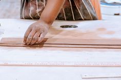 a person working on some kind of wood