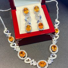 ENJOY OUR WORRY-FREE SERVICE AND THE DAZZLING, GENUINE JEWELRY WE DESIGN AND HANDCRAFT WITH LOVE❤️ ABOUT THE ITEM: SPARKLING! SHIMMERING, DANGLING VIVID ORANGE YELLOW SAPPHIRE EARRINGS! SO PRECIOUS! CERTIFIED 12.68 Total Carats, with 4 pieces of Thai yellow sapphires and 1.21 carats of F/VS, natural diamonds, set in handmade 10.0 grams, 18K solid white gold, CHIC dangling earrings. One of a kind! At 3.6 centimeter in drop length, perfect for both formal and causal events! ONE OF A KIND HANDCRAFT Yellow Sapphire Earrings, Gold Chic, White Gold Pendant Necklace, Earrings Dangling, Golden South Sea Pearls, Solid Gold Earrings, Blue Sapphire Diamond, Orange Sapphire, Free Service