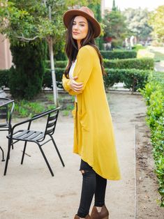 A fun twist on a classic cut. The button down detailing and the high low hem is so flattering & stylish. Details Small 0-4 Medium 6-8 Large 10-12 XL 12-14 Model is 5'5" wearing small Yellow Casual Cardigan With Pockets, Casual Yellow Cardigan With Pockets, Spring Button-up Cardigan In Solid Color, Spring Button-up Solid Color Cardigan, Spring Solid Color Button-up Cardigan, Yellow Casual Spring Cardigan, Casual Yellow Spring Cardigan, Solid Cardigan For Day Out In Fall, Solid Cardigan For Fall Day Out