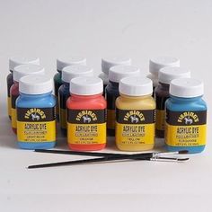 several different colors of acrylic paint next to each other