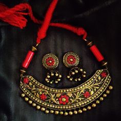 Handcrafted Moroccan style terracota jewelry. Looks great with Traditional clothes or casuals also. Traditional Red Hand-painted Necklace, Traditional Red Hand Painted Necklace, Artisan Red Jewelry With Artistic Design, Traditional Handmade Red Jewelry, Red Hand Painted Jewelry For Festivals, Handmade Orange Jewelry For Festive Season, Festive Artisan Red Jewelry, Festive Red Artisan Jewelry, Adjustable Hand-painted Red Jewelry