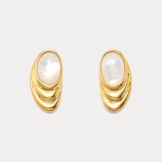 Shop our exquisite Oval Dome Cabochon Gold Pearl Earrings. Each piece showcases a lustrous freshwater pearl set in polished 18K gold-plated brass, exuding timeless sophistication. The cabochon’s smooth dome reflects light beautifully, enhancing the natural allure of the pearls. Designed for versatility, they transition seamlessly from daywear to evening glamour. Make a statement with these gold pearl drop earrings, a testament to classic style with a modern twist. Perfect for those who appreciate the finer details, they add a touch of luxury to any ensemble.  A must-have addition to your pearl jewelry collection. DETAILS Plating: 18K Gold  Materials: 18K Gold on Brass, Freshwater Pearl Size: 0.98"* 0.51 "(2.5cm*1.3cm) Weight: 7.8g/pr Elegant Gold Pearl Earrings With Polished Finish, Yellow Gold Oval Pearl Earrings, Formal Gold Pearl Earrings Cabochon, Gold Oval Cabochon Earrings For Formal Occasions, Gold Oval Cabochon Earrings With Polished Finish, Classic Gold Mother Of Pearl Earrings, Classic Mother Of Pearl Gold Earrings, Gold Oval Cabochon Earrings For Anniversary, Anniversary Gold Oval Cabochon Earrings