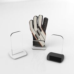 an oven mitt and holder on a white surface with a black object next to it