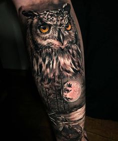 an owl with yellow eyes is shown on the forearm and arm, as well as a full