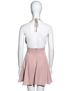 For Sale on 1stDibs - ▪ Dolce & Gabbana pink crepe skater dress ▪ 79% Acetate, 21% Rayon ▪ Nipping in at the waist and flaring out into a full skirt ▪ Halter-neck with string Feminine Pink Mini Length Halter Dress, Pink V-neck Halter Dress For Night Out, Pink V-neck Halter Dress For Date Night, Feminine Pink Halter Neck Mini Dress, Pink Fitted Feminine Halter Dress, Fitted Feminine Pink Halter Dress, Feminine Fitted Pink Halter Dress, Feminine Pink Fitted Halter Dress, Pink Fitted Halter Mini Dress