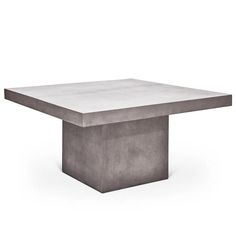 the concrete table is made from cement blocks and has a square base with a rectangular top