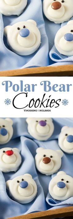 polar bear cookies with white frosting and blue icing are on display in a box