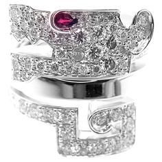 18k White Gold Le Baiser Du Dragon Diamond Ruby Ring by Cartier. With 56 round brilliant cut diamonds VVS1 clarity, E color total weight approx. 1.68ct This ring comes with Cartier box and a service paper from a Cartier store. Details: Ring Size: European 49, US 4 3/4 Width: 19mm Weight: 13.8 grams Stamped Hallmarks: Cartier 750 49 448XXX(serial number omitted) French Hallmarks *Free Shipping within the United States* YOUR PRICE: $20,500 T3102redd Cartier Store, Authentic Jewelry, Ruby Ring, Gold Diamond Rings, Love Bracelets, Brilliant Diamond, Buying Jewelry, Designer Jewelry, Estate Jewelry