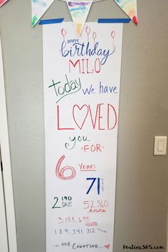 a birthday sign hanging on the wall