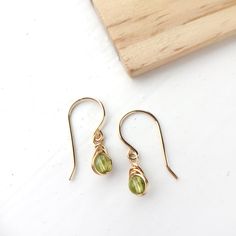 Peridot Dangle Earrings, 14K Gold Filled, Rose Gold Filled, Sterling Silver, August Birthstone Green Peridot Earrings https://etsy.me/2pFc4gK #jewellery #earrings #birthday #minimalist #peridot Dainty Earrings For Jewelry Making With May Birthstone, Peridot Dangle Earrings In Gold, Gold Peridot Gemstone Earrings, Yellow Gold Wire Wrapped Earrings For Gift, Peridot Dangle Earrings Gift, Gold Teardrop Peridot Earrings, Gold Peridot Earrings For May Birthstone, Nickel-free Yellow Gold Briolette Earrings, Nickel-free Briolette Yellow Gold Earrings