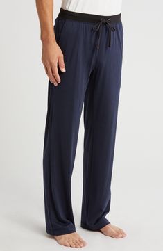 A stretchy, contrast drawstring waistband tops easy lounge pants cut from buttery-soft Peruvian pima cotton. 33" inseam; 18" leg opening; 11 1/2" front rise; 16" back rise (size Medium). Elastic/drawstring waistband. Slant pockets; back patch pocket. 100% Peruvian pima cotton. Machine wash, tumble dry. By Daniel Buchler; imported. Men's Furnishings. Navy Loungewear Pants, Navy Athleisure Pants For Loungewear, Navy Relaxed Fit Pants For Loungewear, Comfortable Navy Loungewear Bottoms, Comfortable Navy Bottoms For Loungewear, Navy Elastic Waistband Pants For Loungewear, Navy Pants With Elastic Waistband For Loungewear, Comfort Stretch Loungewear Pants With Straight Hem, Comfort Stretch Pants For Loungewear With Straight Hem