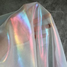 This rainbow reflective fabric is designed specifically for making clothing and accessories that stand out in a crowd. The fabric is iridescent and features a rainbow holographic laser effect. It's designed specifically for making attention-grabbing pieces that will turn heads. Dimension: Width: 150cm / 59 inches Wash: Dry wash is recommened The fabric is top qulaity designer farbric on the market. It is lightness, color illusion, good drape, and a cool touch. It is perfect for swimwear, dresses Color Illusions, Holographic Fabric, Iridescent Fabric, Dance Clothing, Posing Suits, Shiny Fabric, Dance Outfits, Chiffon Fabric, Belly Dance