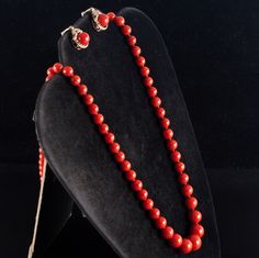 Vintage 1960's 18k Yellow Gold Natural AAA Red Coral Necklace Earring Set 57.37gMetal Information: 18k Yellow GoldTotal Weight: 57.37gNecklace Width: 12mm - 6.1mmNecklace Length: 25"Earring Dimensions: 18mm x 12.8mmCirca: 1960'sStone InformationMain StoneGem Type: CoralShape: Round Bead (12mm - 6.1mm)Color: RedClarity/Quality: AAANumber of Stones: 79Accent StonesGem Type: CoralShape: Oval Cabochon (18mm x 8.2mm)Color: RedClarity/Quality: AAANumber of Stones: 1Estimated Retail Price: $7690.00OUR Traditional Jewelry With Matching Earrings For Evening, Traditional Single Strand Formal Jewelry, Fine Jewelry Evening Necklace With Matching Earrings, Evening Fine Jewelry Necklace With Matching Earrings, Fine Jewelry Necklace With Matching Earrings For Evening, Fine Jewelry Red Jewelry For Evening, Formal Red Round Beaded Jewelry, Red Jewelry With Earrings For Evening, Red Costume Jewelry Sets For Formal Occasions