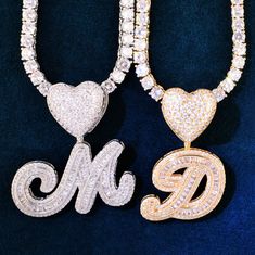 How about a little bling to accent your décolletage? This A Z Heart Bail Initial Cursive Letter Pendant With Tennis Chain is the perfect accessory to add a little sparkle to your outfit. The single letter pendant is adorned with cubic zirconia stones and comes on a gold-plated tennis chain. It's dainty, yet eye-catching and can be worn with just about anything. Whether you're dressing up for a night out or just want to add a touch of glam to your everyday look, this necklace is sure to do the tr Heart Cut Bling Necklace For Valentine's Day, Valentine's Day Heart Cut Necklace With Bling, Valentine's Day Heart Cut Bling Necklace, Bling Cubic Zirconia Necklaces For Valentine's Day, Valentine's Day Bling Cubic Zirconia Necklaces, Heart Shaped Bling Necklace For Gift, Valentine's Day Party Heart Necklace In Cubic Zirconia, Valentine's Day Heart Pendant Jewelry With Bling, Dazzling Bling Necklace Gift