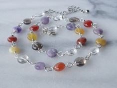 This multi color necklace is packed with gemstones. A sparkly mix of amethyst, carnelian, jade and quartz gemstones. Perfect for anyone that wants to make a statement or to wear to a special occasion. A length is 15.5'' ( 38.75 cm.)  and  3'' ( 7.5 cm.)  extender. The necklace will be packaged in a gift box. Your jewelry is ready to ship. Thank you for visiting my shop. Tiny Necklace, Multi Coloured Necklaces, Red Coral Necklace, Bamboo Coral, Coral Necklace, Quartz Necklace, Red Coral, Multi Stone, Stone Necklace