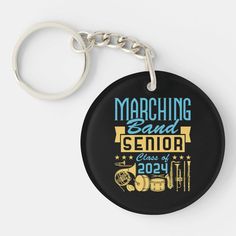 a black keychain that says marching band senior class of 2014