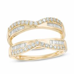 a yellow gold ring with two rows of baguettes in the middle and one row of diamonds on each band